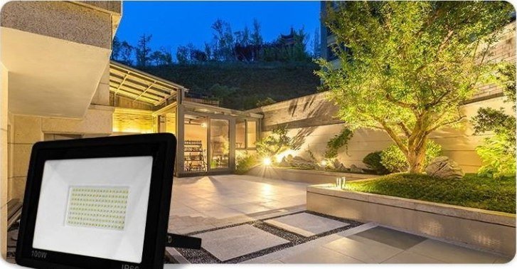 Slim LED floodlight lighting a residential courtyard at night