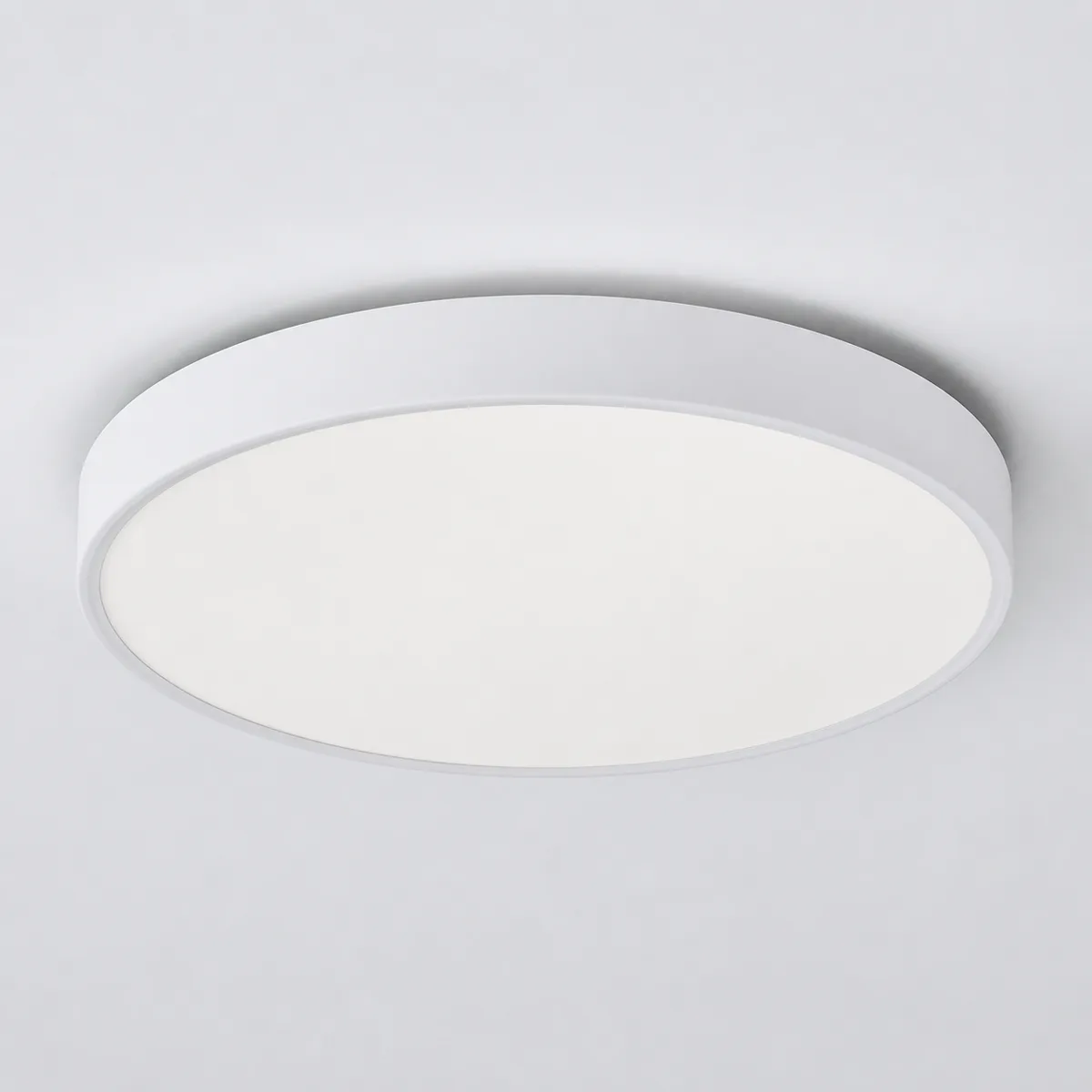 Representative round flush-mount LED ceiling light on a light background
